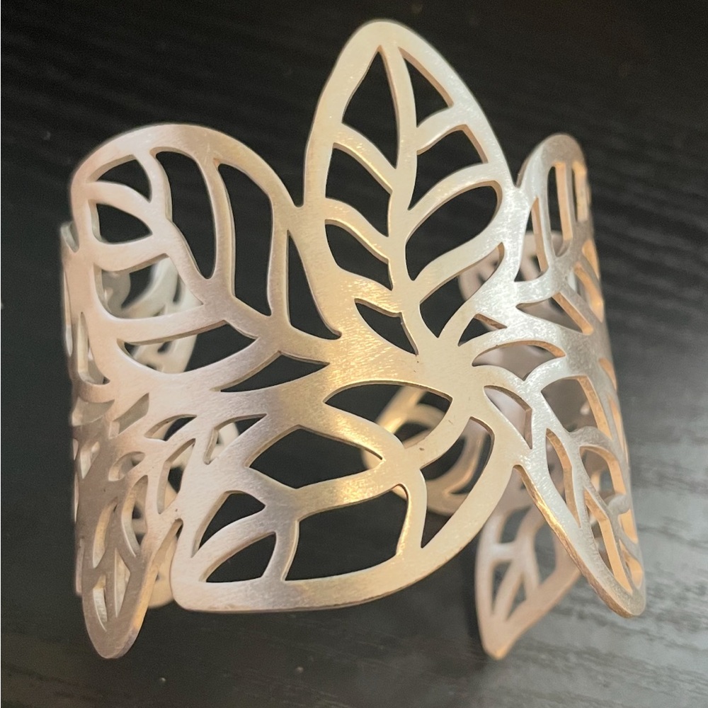 Glow by Sheila Fajl bracelet cuff silver tone metal leaf motif 2.5” wide adjusts